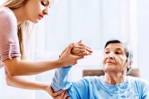 A senior woman receiving physical therapy.